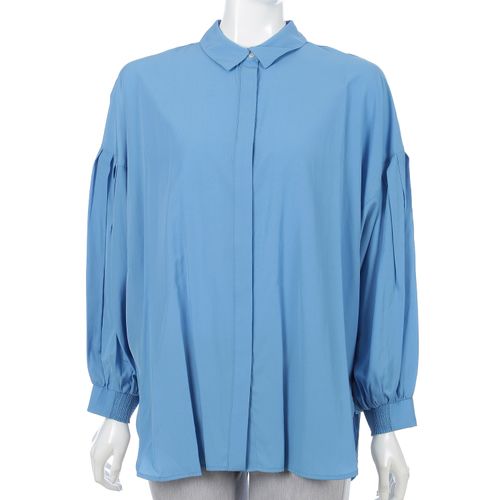 Un carnet
ドルマンシャツ